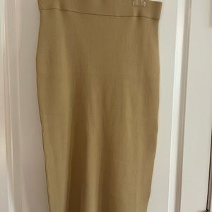 Never worn- purchased from Amazon Drop, stretch, long skirt, tan -size Medium